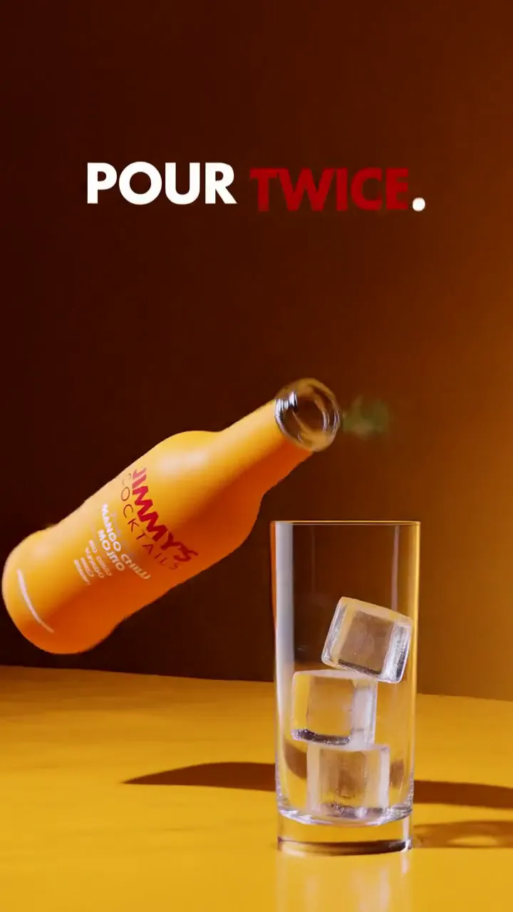 Film frame: Pour twice, the bottle pouring into a highball